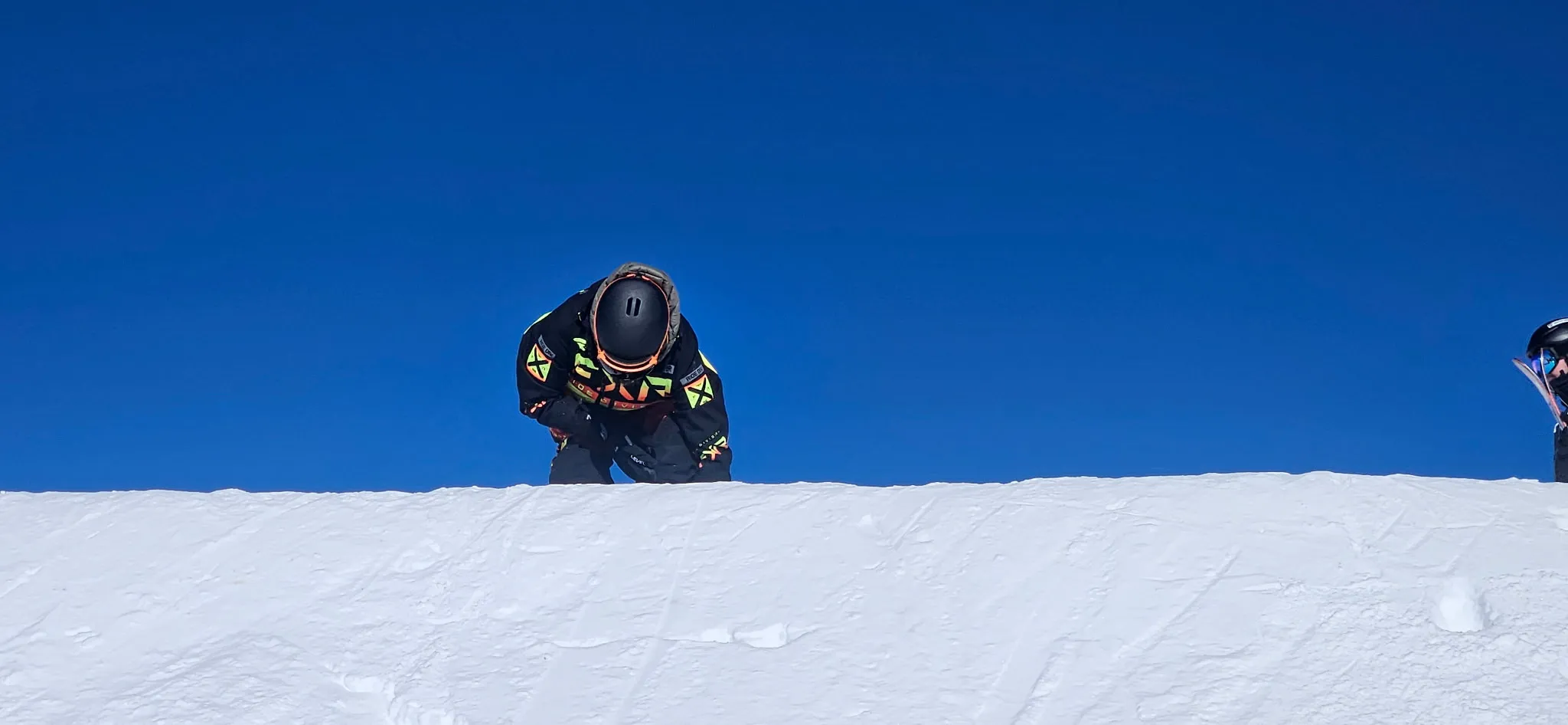 Morgan snowboarding on the hill